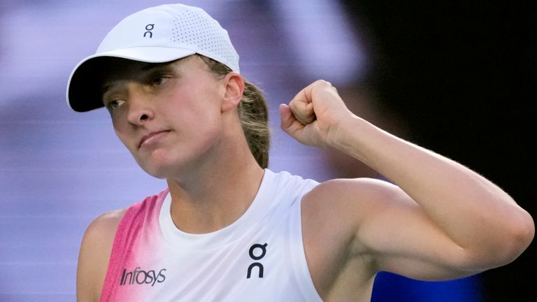 Iga Swiatek of Poland reacts after defeating Eva Lys of Germany in their fourth round match at the Australian Open tennis championship in Melbourne, Australia, Monday, Jan. 20, 2025. (AP Photo/Vincent Thian)