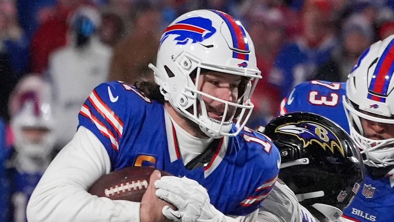 Buffalo Bills quarterback Josh Allen (17) carries the ball against the Baltimore Ravens during the fourth quarter of an NFL divisional playoff football game, Sunday, Jan. 19, 2025, in Orchard Park, N.Y. (AP Photo/Gene J. Puskar)